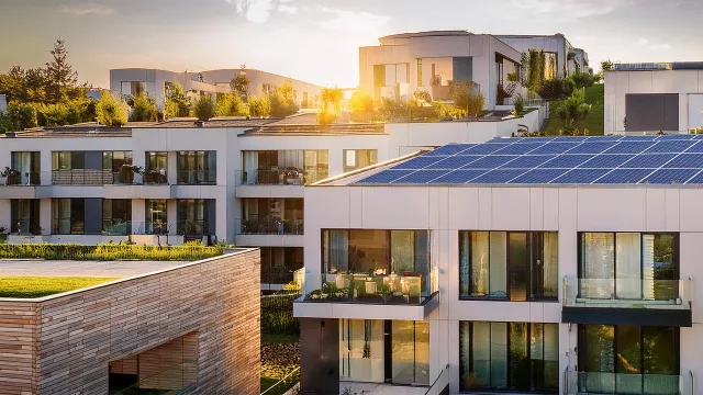 Multi family house with pv-system on the roof.